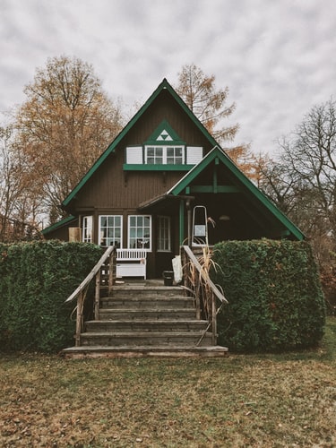 green wooden house 